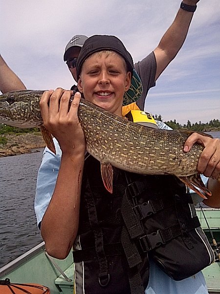 Parry Sound Unorganized Centre Part-20110701-00011.jpg - Nick and his first pike he caught last summer.